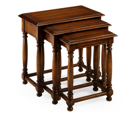 Nest of three walnut tables with plank tops