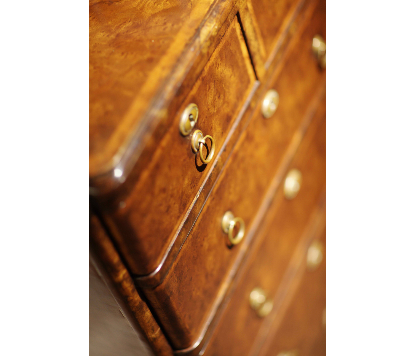 Bow front walnut chest of six drawers