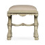 Heavily carved French provincial green x-frame footstool