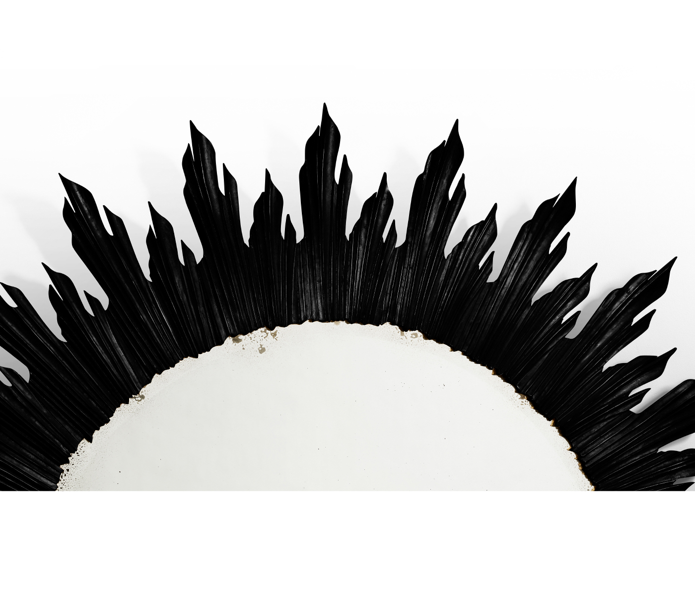 Large black sunburst mirror
