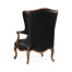 Wing-backed chair in black leather