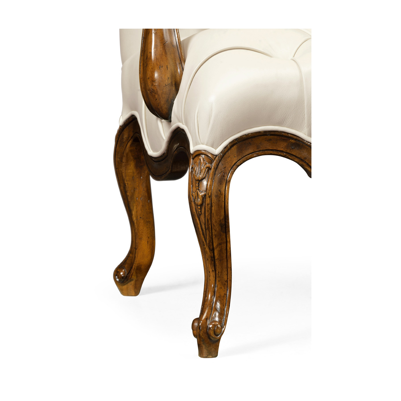 Wing-backed chair in cream leather